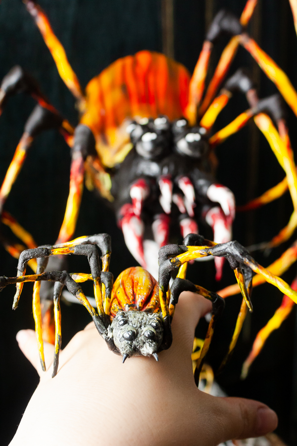 Black and orange spider designs, large and miniature.